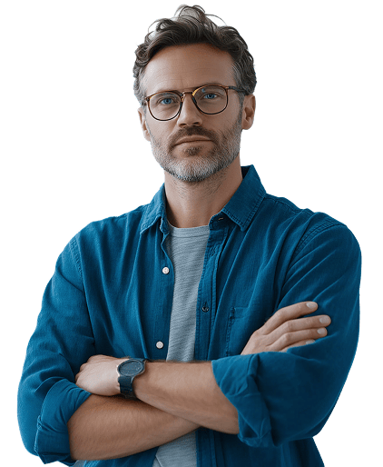 A SOC analyst in a blue shirt, arms crossed